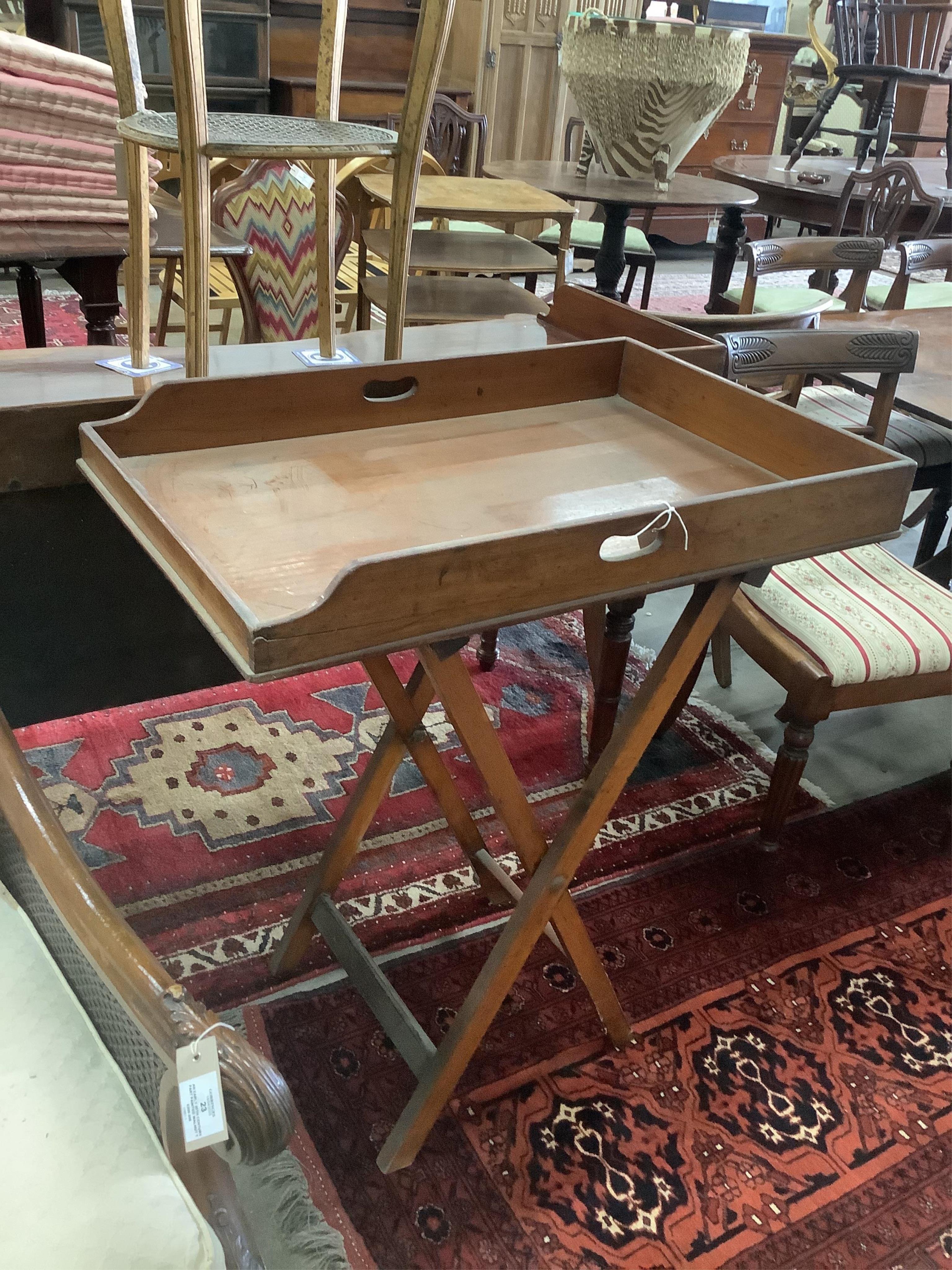 A Victorian rectangular mahogany butler's tray on folding stand, width 78cm, depth 52cm, height 90cm. Condition - fair